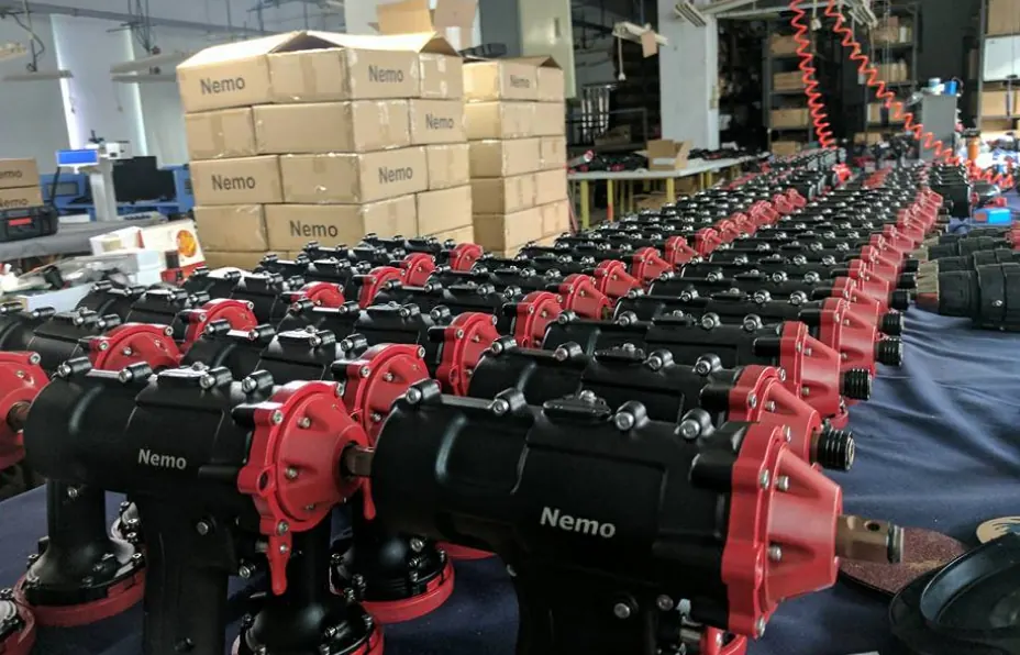 Rows of red and black Nemo drills on the assembly line