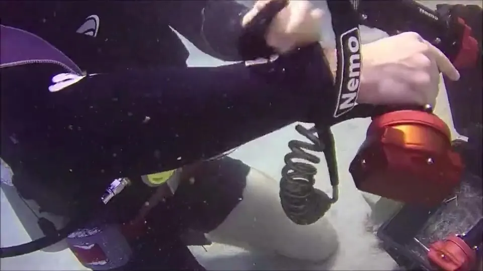 A diver running a red Nemo drill on the sea floor
