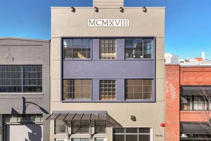 The ProtoLab building, a three-story facade marked MCMXVIII
